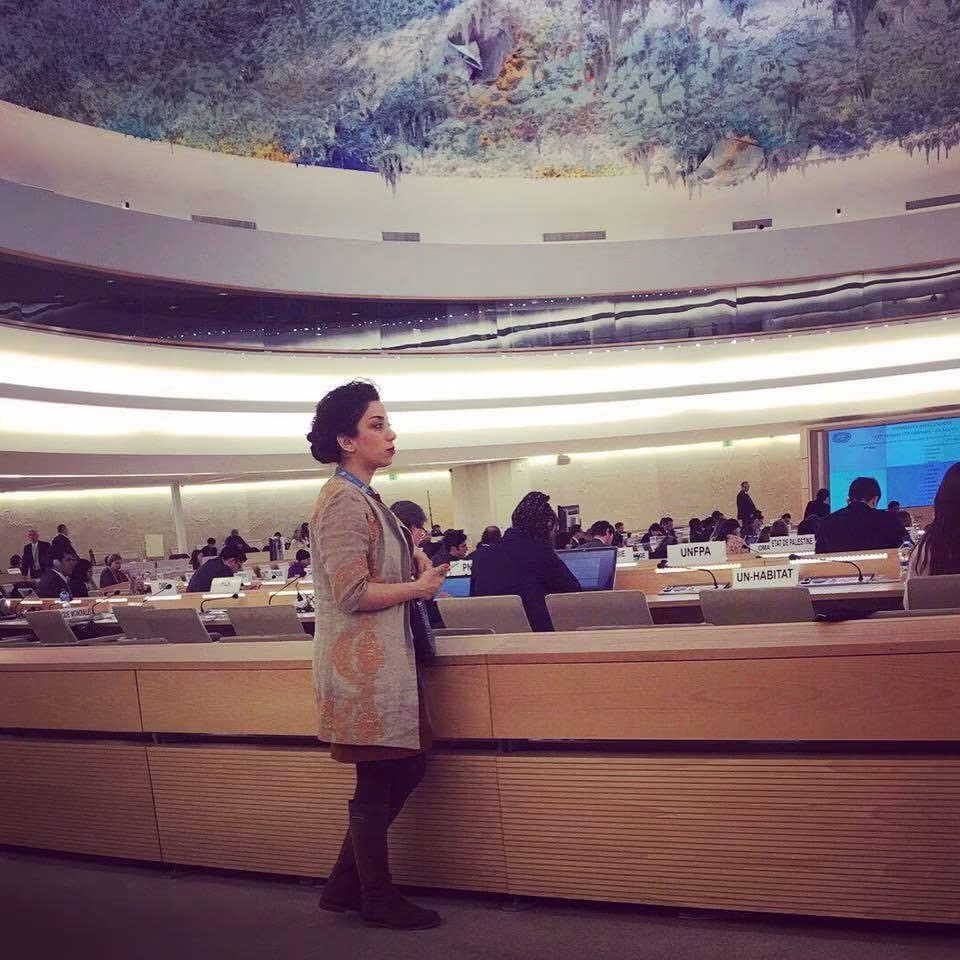 Parastoo Fatemi standing in the Human Rights Council chamber during a session