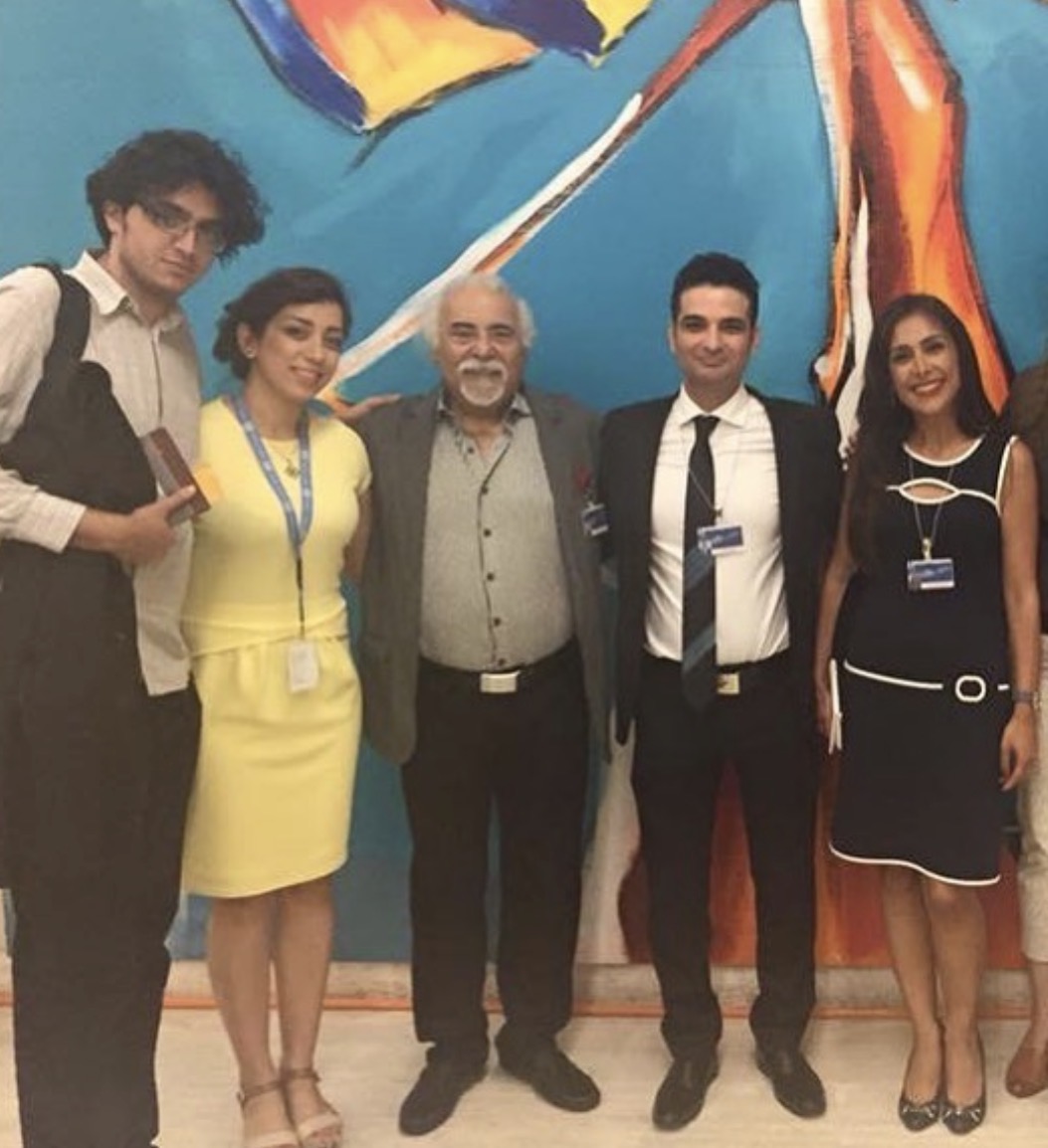 Parastoo Fatemi with speakers of the side event at the UN in Geneva, in front of a colourful mural