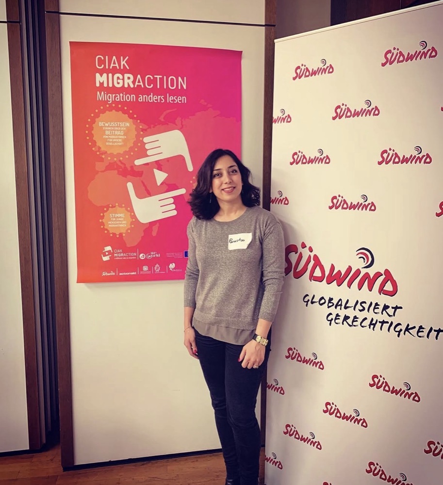 Parastoo Fatemi next to the CIAK MIGRACTION poster and a Südwind banner